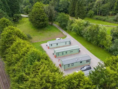 an overhead view of three trailers in a parking lot at Lodge 4 in Carnforth