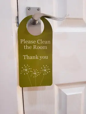 a sign on a door that reads please clean the room thank you at RockDene in Blackpool
