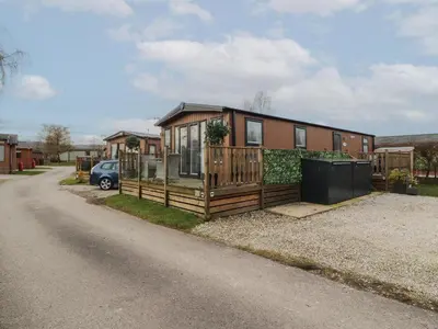 a house on the side of a road at 24 Sherwood in Carnforth