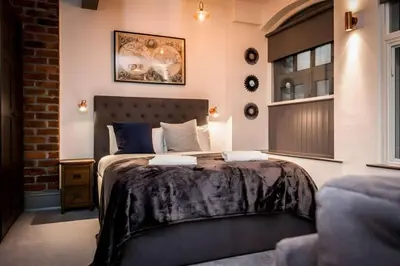 a bedroom with a large bed in a room at Bands Warehouse I in Liverpool