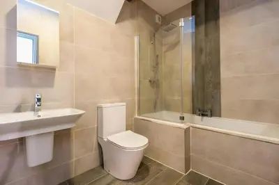 a bathroom with a toilet and a sink and a tub at Bands Warehouse I in Liverpool
