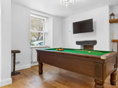 a pool table in a room with a tv at Lovely 2 Bed With Pool Table Ulverston - Pass the Keys in Ulverston