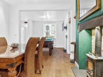 a living room with a table and a pool table at Lovely 2 Bed With Pool Table Ulverston - Pass the Keys in Ulverston