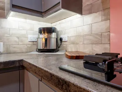 a kitchen counter with a toaster on top of it at Lovely 2 Bed With Pool Table Ulverston - Pass the Keys in Ulverston