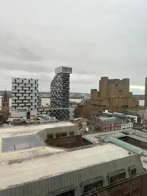 an aerial view of a city with tall buildings at Two Bedroom City View Apartment Liverpool by StaySavvy Accommodation in Liverpool