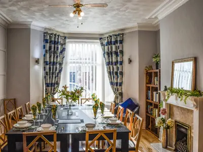 a dining room with a table and chairs at The Sandcastle in Blackpool