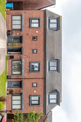 an aerial view of a tall brick building with windows at Town house Anfield stadium in Liverpool