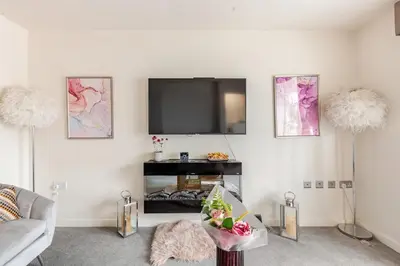a living room with a flat screen tv on the wall at Town house Anfield stadium in Liverpool