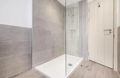 a bathroom with a shower with a glass door at 71 Townhouse By Elite in Liverpool