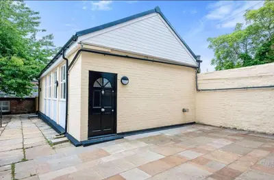 a large building with a black door on it at The Coach House by Elite in Liverpool