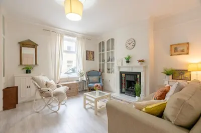 a living room with a couch and a fireplace at Clitheroe Wilson Retreat. Central Lancashire in Clitheroe