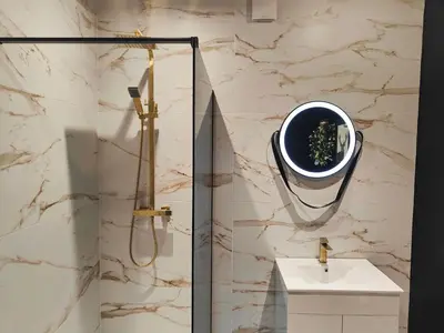 a bathroom with a shower and a sink at Ocean Breeze in Blackpool