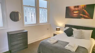 a bedroom with a bed with two towels on it at Irwell Chambers by L3 Apartments in Liverpool
