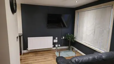 a living room with a glass table and a couch at Irwell Chambers by L3 Apartments in Liverpool