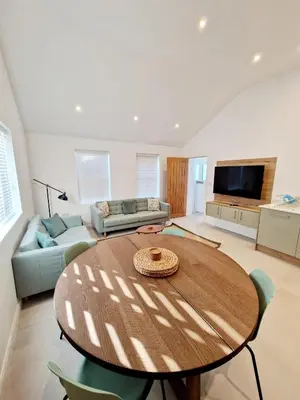 a living room with a table and a couch at The Old Bakehouse in Ulverston