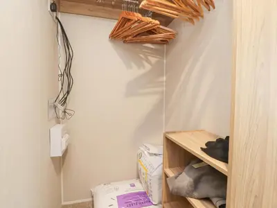 a room with a closet with a shelf and a box at FGH Holidays in Morecambe