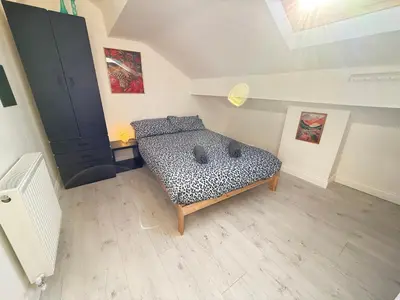 a bedroom with a leopard print bed in a room at Holm from Home sleeps 10 in Blackpool