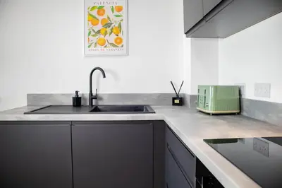 a kitchen with a sink and a counter top at Oriel Suite - Central - Contractors - 6 Beds in Liverpool