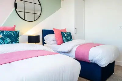 two beds sitting next to each other in a bedroom at Oriel Suite - Central - Contractors - 6 Beds in Liverpool