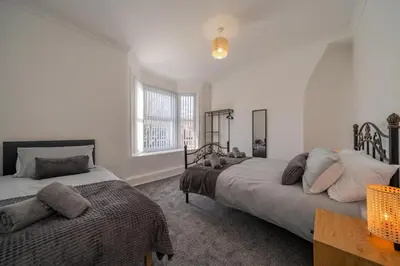 a bedroom with two beds and a window at The place I remember in Liverpool