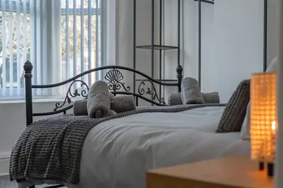 a bedroom with a bed with teddy bears on it at The place I remember in Liverpool