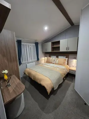 a bedroom with a large bed in a room at Tw Luxury Caravan in Longridge