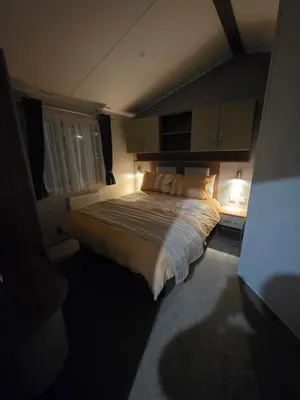 a bedroom with a large bed in a room at Tw Luxury Caravan in Longridge