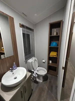 a bathroom with a white toilet and a sink at Tw Luxury Caravan in Longridge