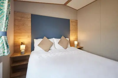 a bedroom with a large white bed with two pillows at Host & Stay - Grange in Morecambe