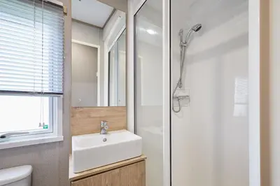 a bathroom with a sink and a shower at Host & Stay - Grange in Morecambe