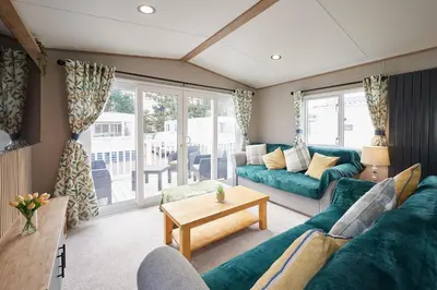 a living room with a couch and a table at Host & Stay - Grange in Morecambe