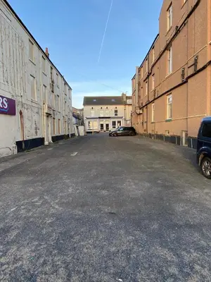 an empty parking lot with a car parked in it at The Beachfront Hotel in Blackpool