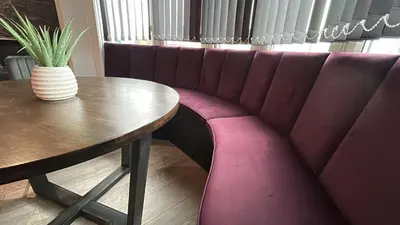 a table and a purple bench in a restaurant at Luxury Seaside Apartments with Free Parking in Blackpool