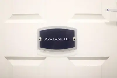 a sign that says awakeningride on a white table at Avalanche 1 Bed Apartment in Blackpool