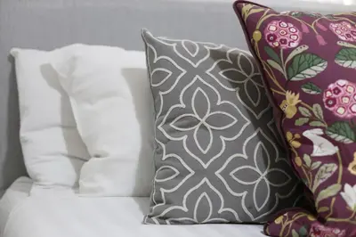 a group of pillows sitting on top of a couch at Big Dipper 2 Bed Pleasure Beach in Blackpool