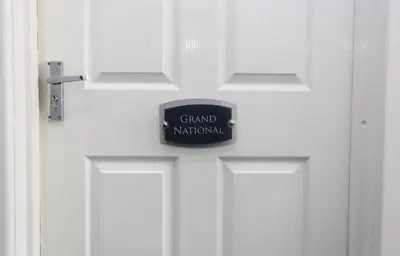 a door with a sign that reads grand national at Grand National 1-Bed Very Close to Pleasure Beach in Blackpool