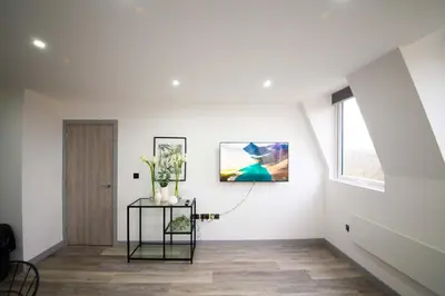 a white room with a table and a window at Spacious 2 Bedroom Apartment in Central Preston in Preston