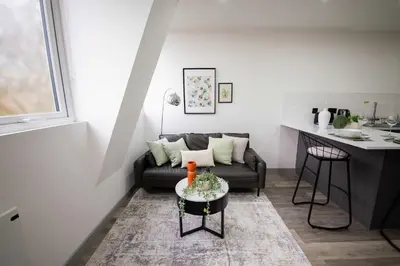 a living room with a couch and a table at Spacious 2 Bedroom Apartment in Central Preston in Preston