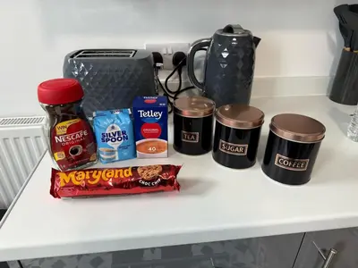 a counter top with a group of food and drinks at 3BR Accommodation in St Helens - Sleeps 6 in Saint Helens