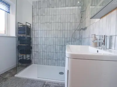 a bathroom with a sink and a shower at 38 Clive Avenue in Lytham St Annes