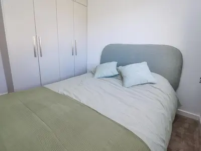a bedroom with a bed with two pillows on it at 38 Clive Avenue in Lytham St Annes