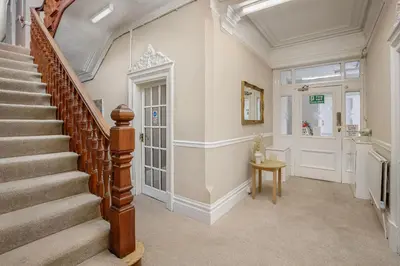a staircase in a home with a stair case at Hotel Sofia Blackpool in Blackpool