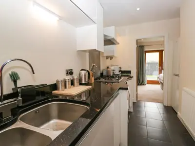 a kitchen with a sink and a counter top at 7 Sandpiper in Carnforth