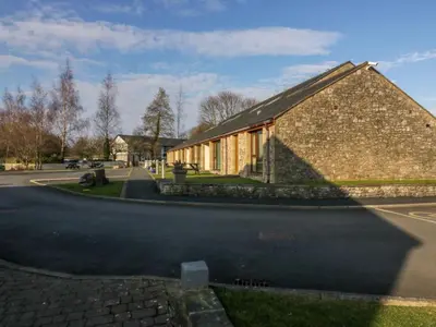 a large brick building on the side of a road at 7 Sandpiper in Carnforth