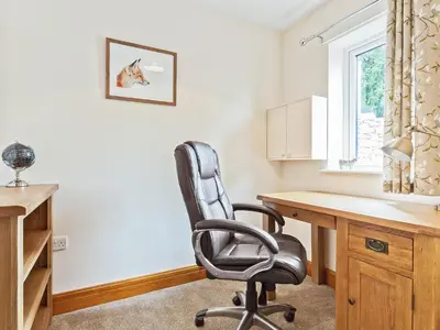 an office with a desk and a chair at Pier Cottage in Arnside