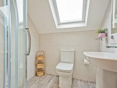 a bathroom with a toilet and a sink at Keer Cottage in Carnforth