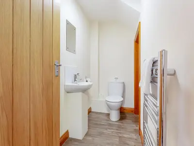 a bathroom with a toilet and a sink at The Pepperpot - Uk49156 in Silverdale