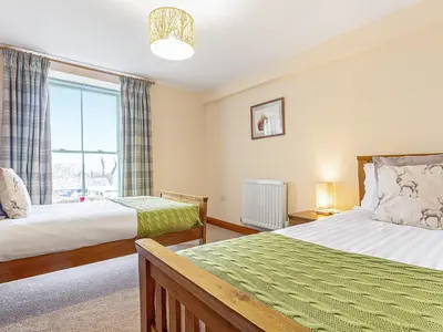 a bedroom with two beds and a window at The Knott - Uk49161 in Silverdale