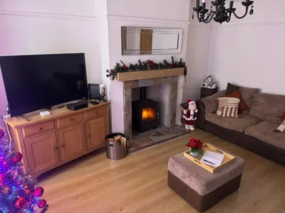 a living room with a television and a fireplace at Knotty Ash - 3 Beds - Sleeps 6 - On-Site Parking in Liverpool