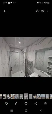 a bathroom with a large mirror and a sink at Amazing Central House in Blackpool